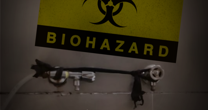 A dark, edited photograph features a yellow and black 'CAUTION BIOHAZARD' sign with a biohazard symbol, taped to a wall in the upper portion of the image. Below the sign, there is a set of metal valves and pipes, with black tape wrapped around the connections. A hose is attached to one of the valves and extends out of the frame. The background consists of a tiled wall with visible cracks and stains.