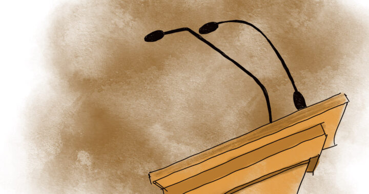 A side-view of a podium with mics on it, in front of a dusty brown haze.